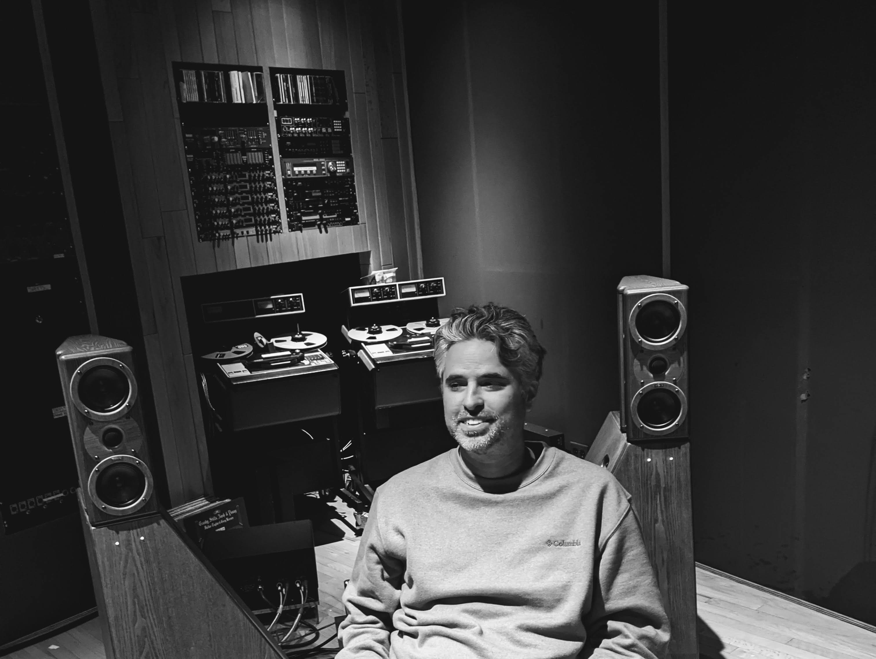 Ron Pastore in his recording studio with monitors and reel-to-reel equipment